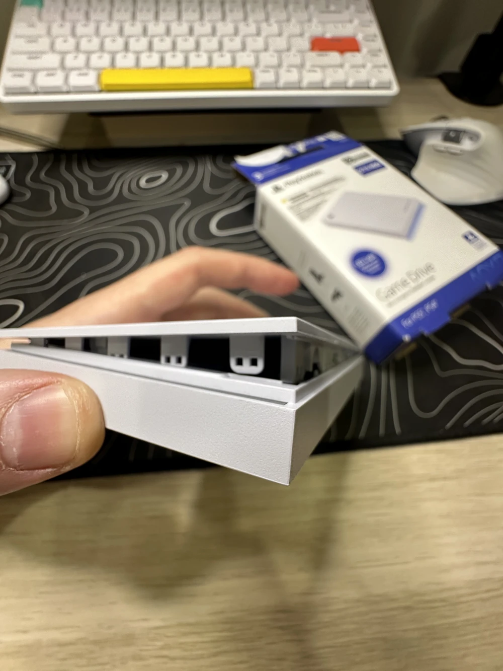 The start of prying, plastic clips visible