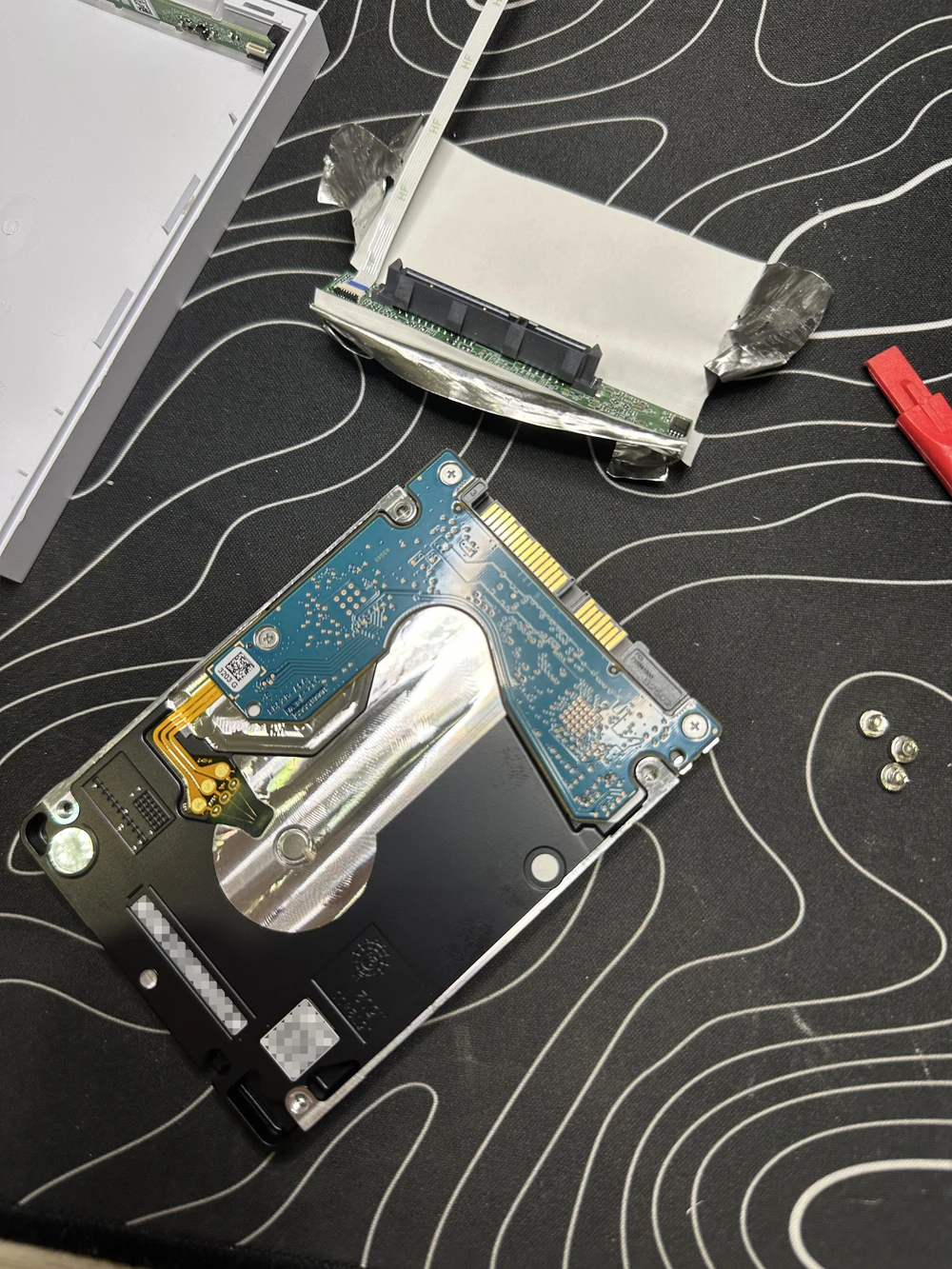 SATA↔USB Micro-B adapter removed, screws from the sides removed